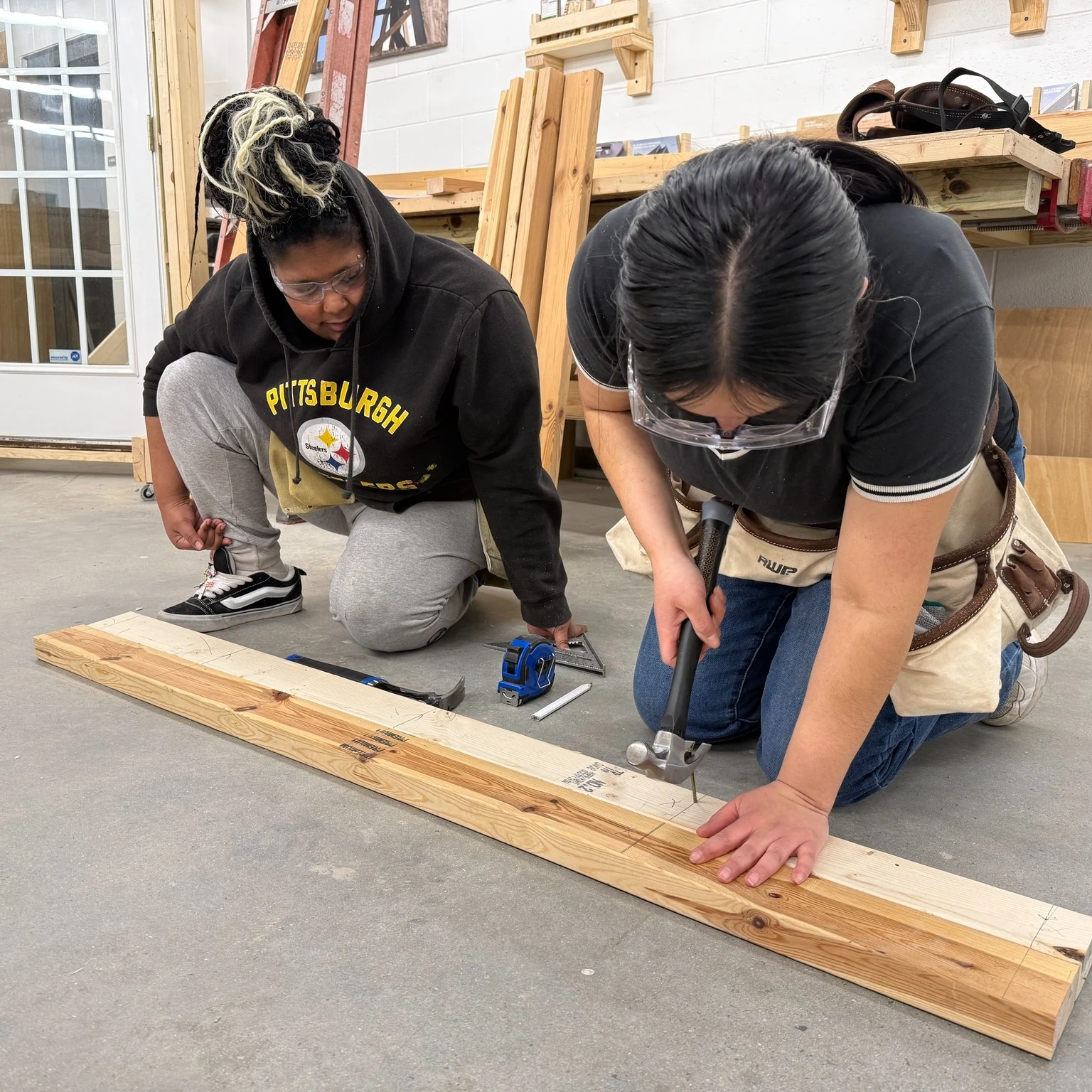 A Hope Renovations instructor working one-on-one with a trainee